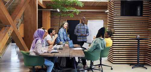 Smiling group of diverse businesspeople meeting at work