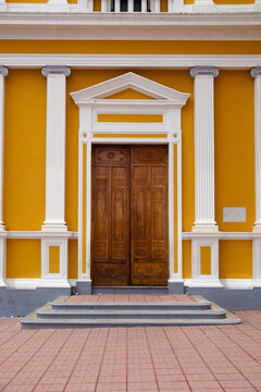 Entrance To The Yellow House In Nicaragua With Wooden Door