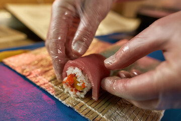 Chef cooking delicious sushi in the restaurant