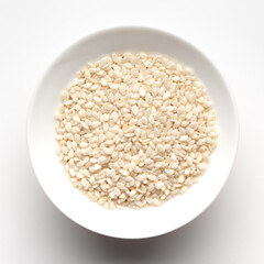 Macro Close up of Organic White  Sesame seeds(Sesamum indicum) polished or white Til without shell inside a white ceramic bowl