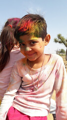 beautiful Indian girl in colors powder on Holi celebration