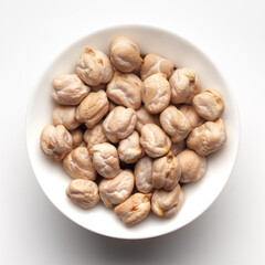 Macro Close-up of Organic chhole chana or Kabuli chana (Cicer arietinum) or whole white Bengal gram dal inside a ceramic white bowl. Top view 