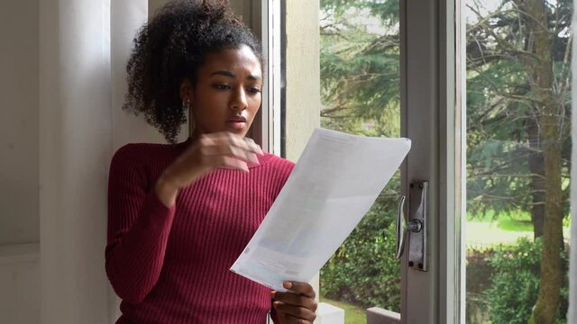 Video about one black woman getting bad news letter at home