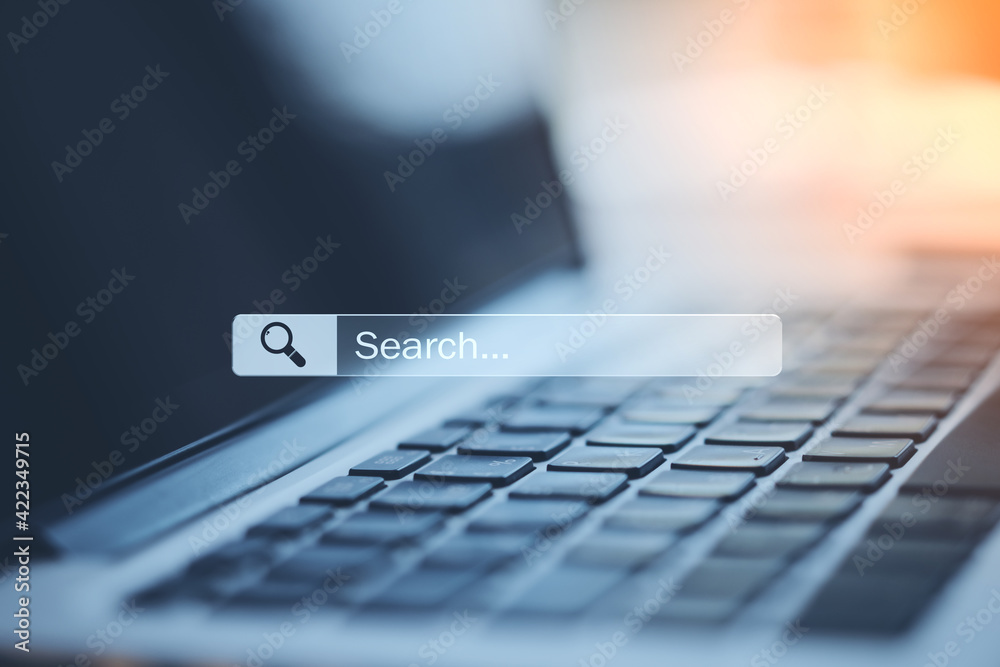 Poster search and navigation bar on digital screen and laptop keyboard, online searching concept