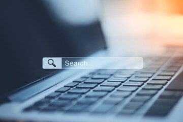 Search and navigation bar on digital screen and laptop keyboard, online searching concept