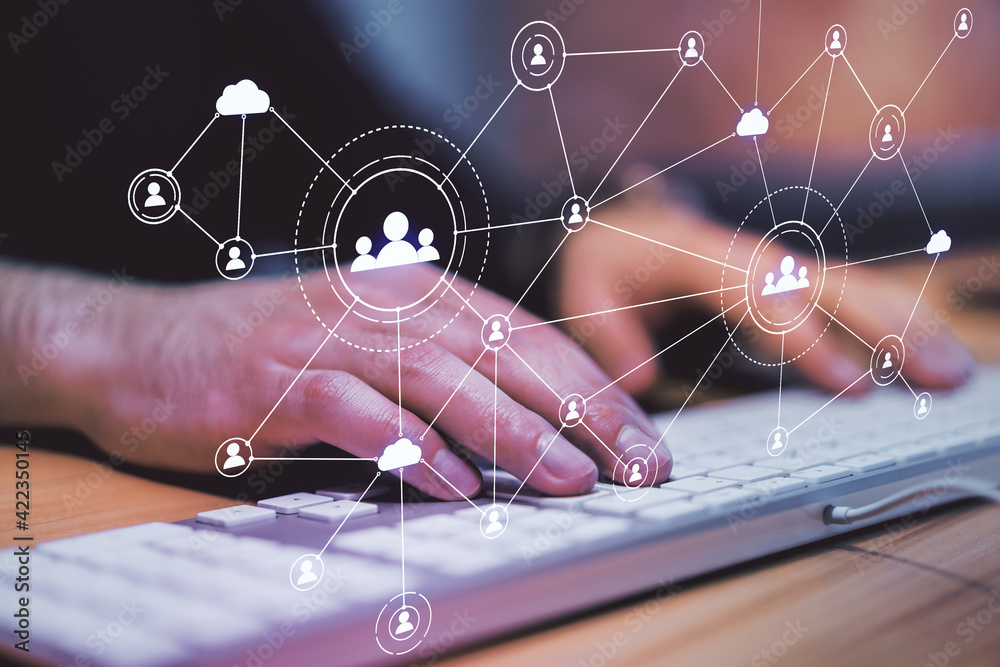 Aufkleber Corporate networking concept with digital screen with application icons and man hand typing on computer keyboard