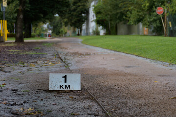 sign indicating the mileage on the side of the road