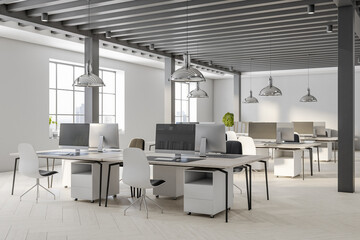 Stylish interior design of spacious coworking office with black wooden decoration posts and white furniture with modern computers, light parquet and big windows with city view