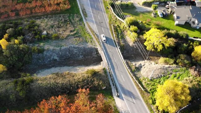 Driving van aerial tracking. Golden hour beautiful colours at New Zealand countryside.