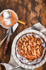 Homemade delicious apple pie, top view, wooden backdrop