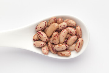 macro Close-up of Organic Lobia,  ( Lobia ) or kidney beans dal on a white ceramic soup spoon. Top view