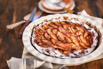 Homemade delicious apple pie, top view, wooden backdrop
