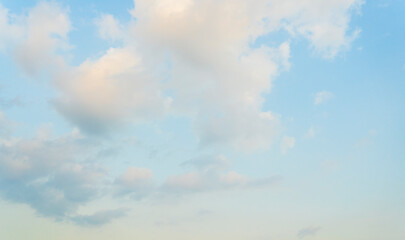 Obraz premium Beautiful view of blue sky with clouds at sunrise. Partly cloudy. Colorful sunset. Natural sky background texture, beautiful color.