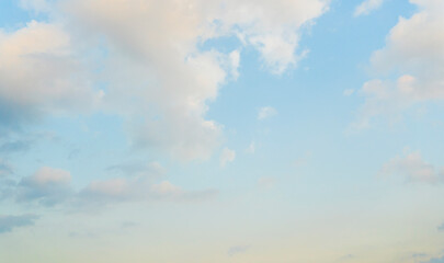 Obraz premium Beautiful view of blue sky with clouds at sunrise. Partly cloudy. Colorful sunset. Natural sky background texture, beautiful color.
