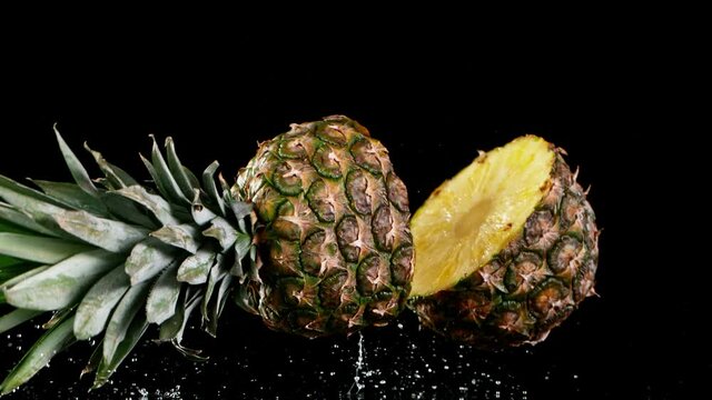 Super slow motion of falling sliced pineapple