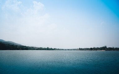  Beautiful lake with green forest and sky