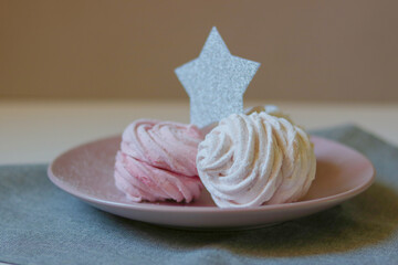 Zephyr sweets on neutral background with star decoration