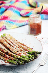 Seasonal fresh asparagus fried with bacon	