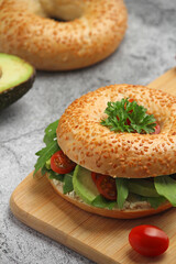 Sesame bagels with tomatoes and avocado