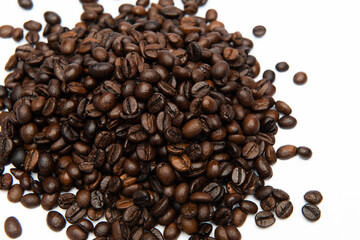 dark roasted coffee beans on a white background