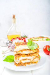 Mediterranean food, Italian traditional lasagna pasta, with bolognese, bechamel and cheese. On white kitchen table background