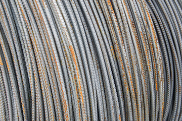 Reinforcement bar, one centimeter thick, rolled into a large roll, warehouse storage.