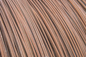 Reinforcement bar, one centimeter thick, rolled into a large roll, warehouse storage.