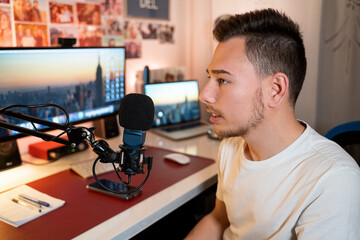 Young man recording podcast or voiceover 