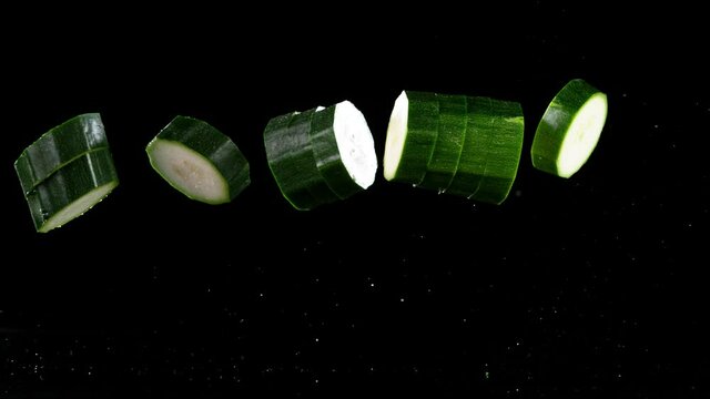 Super slow motion of falling zucchini