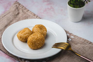 Pinoy Snack or Merienda – Buchi is a type of Chinese fried pastry made from glutinous rice flour, a sweet filling, and sesame seed coating (profile)