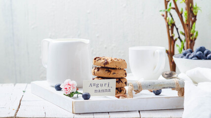 Breakfast with cookies on a white wooden tray for mom's day