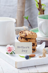 Breakfast with cookies on a white wooden tray for mom's day
