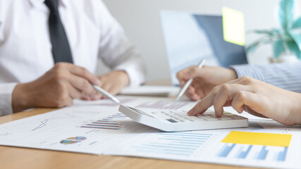 Business team meeting, Marketers and financial accountants are discussing and analyzing charts to plan strategies to meet customer needs, Brainstorming and business discussions.