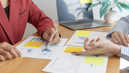 Fototapeta premium Business team meeting, Marketers and financial accountants are discussing and analyzing charts to plan strategies to meet customer needs, Brainstorming and business discussions.