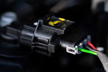 Auto electrician close-up. Car service. Diagnostics of electrical wiring. Car wire connector. 