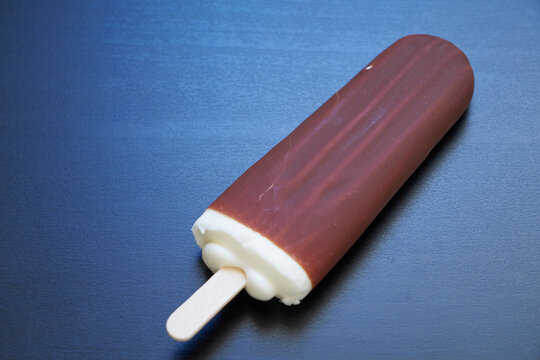 Eskimo ice cream on a stick in a chocolate glaze.
