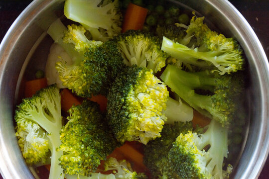 Close up of vegetables steaming in a pot