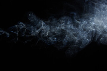 Abstract wisps of smoke on a black background.