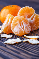 Mandarine orange or tangerine on wooden board