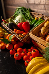 Fresh vegetables in a wooden box on a wooden background. Fruits and vegetables market