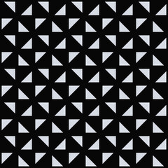 White Triangles Pattern. Black Background. Vector.