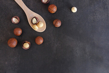 Various nuts on stone table. Top view with copy space.