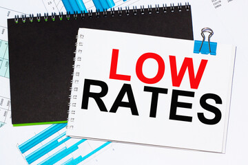 Business concept. List with text sheet LOW RATES of paper for notes