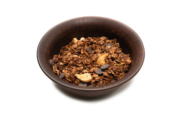 Chocolate granola cereal with nuts in a bowl background.