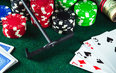 Poker cards with two pairs combination in casino. Chips and rake on the green table