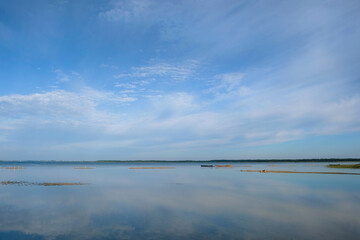 Morning on the lake Svityaz. Clouds are reflected in the water. Shatsky National Natural Park....