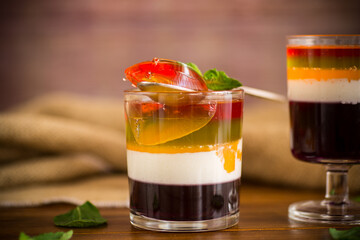 lot of colored sweet fruit jelly in a glass