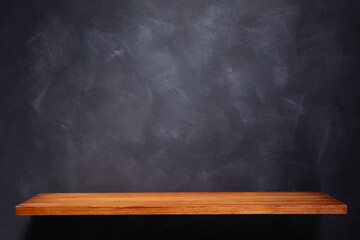 Wooden shelf and painted background texture as abstract wall surface. Book shelf at wall background