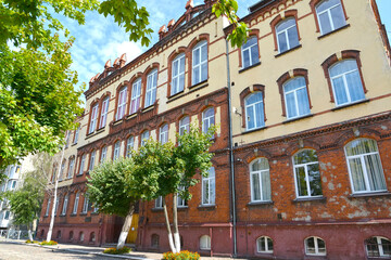 Naklejka premium View of the building of secondary school No. 6 (former secondary school for boys, 1902). Chernyakhovsk, Kaliningrad region