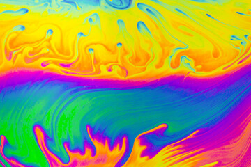Fototapeta na wymiar Psychedelic multicolor patterns background. Photo macro shot of soap bubbles
